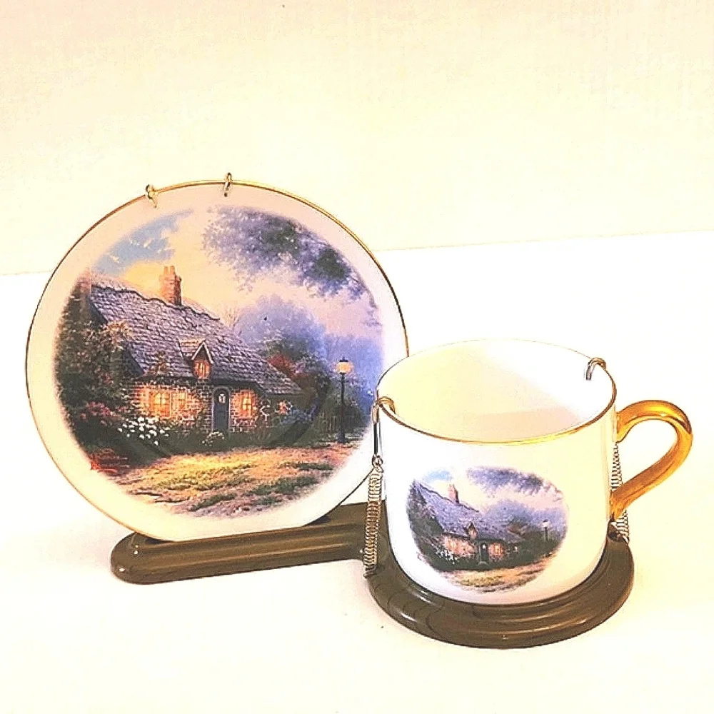Thomas Kincaid Mountain Cottage Saucer and Coffee Cup mounted on easle